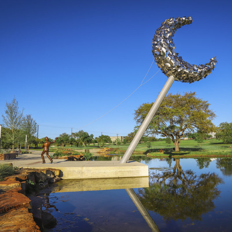 Boy in Running with the Moon public art installation Brad Oldham SculptureEdit